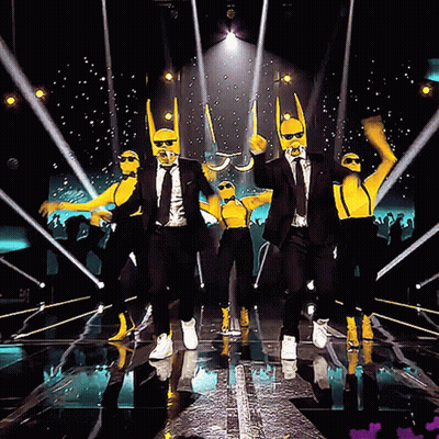 Men In Suits And Suspenders Dancing On Stage GIF