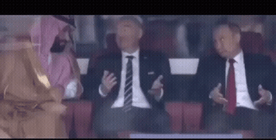 Men In Suits And Ties Sitting In Stadium GIF