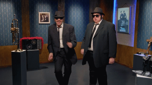 Men In Suits Dancing With Trumpet GIF