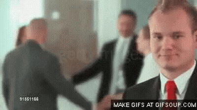 Men In Suits Shaking Hands GIF