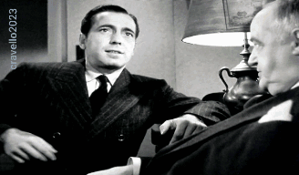 Men In Suits Sitting In Front Of Cravello 2023 Sign GIF