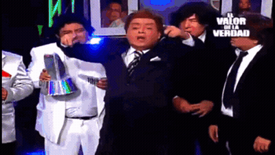 Men In Suits Standing Before Sign El Valor De La Verdad GIF