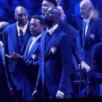 Men In Suits Standing In Front Of Crowd GIF