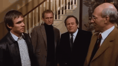 Men In Suits Standing In Front Of Staircase GIF
