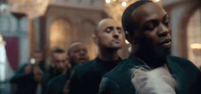 Men In Suits Standing In Room GIF