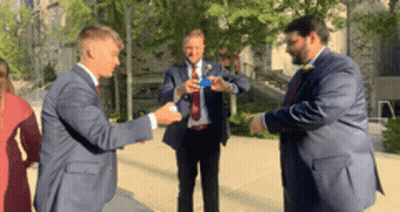 Men In Suits Standing On Sidewalk GIF