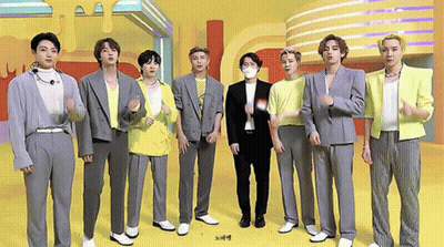 Men In Suits Standing On Stage GIF