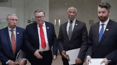 Men In Suits Standing Together Central Florida GIF