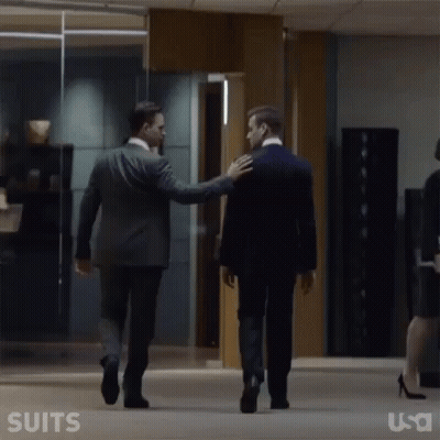 Men In Suits Walking Down Hallway GIF