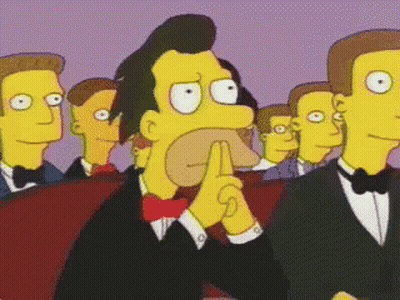 Men In Tuxedos And Bow Ties Watching Cartoon GIF