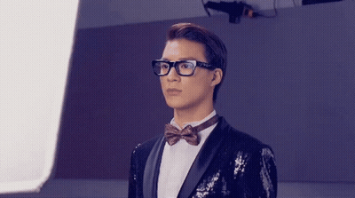 Men In Tuxedos And Suspenders Before Mirror GIF