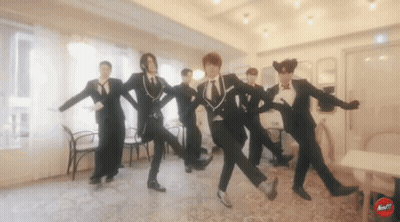 Men In Tuxedos Dancing With Red Next Button GIF