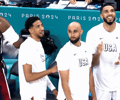 Men In USA Shirts In Front Of Paris 2024 Sign GIF