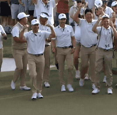 Men In White And Khaki Walking On Green Field GIF