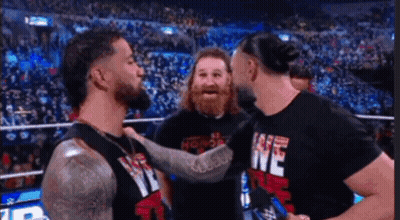 Men In Wrestling Ring One Wearing We Shirt GIF
