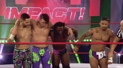 Men In Wrestling Ring With Impact Sign GIF