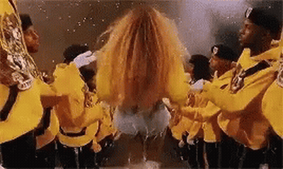 Men In Yellow Uniforms Playing Instruments GIF