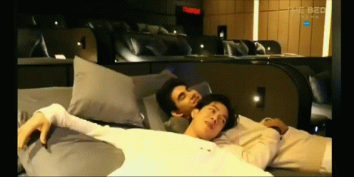 Men Laying On Bed Saying The Bed GIF