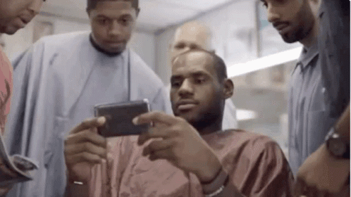 Men Looking At Cell Phone GIF
