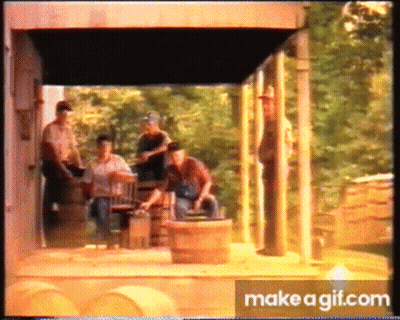 Men On Porch With Barrels And MakeAGif Logo GIF