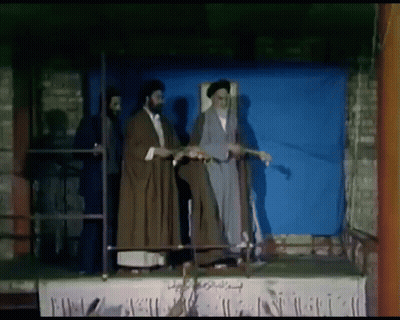 Men On Stage Blue Background GIF