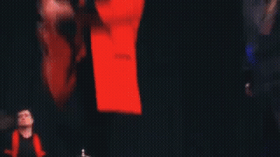 Men Playing Guitars And Singing In Dark Room GIF