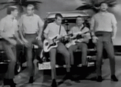 Men Playing Guitars In Front Of Car With NC License Plate GIF