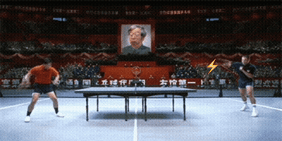Men Playing Ping Pong In Front Of Crowd GIF
