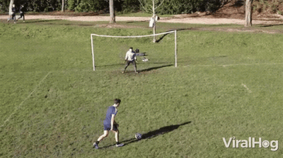 Men Playing Soccer With Goal GIF