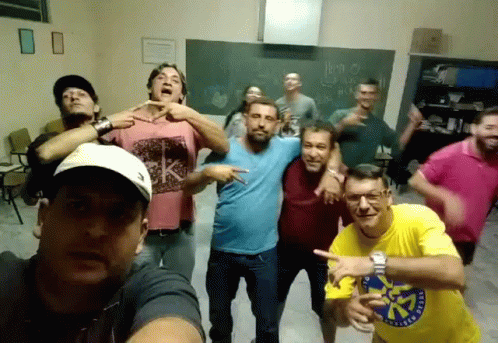 Men Posing With Yellow Shirt Saying A GIF