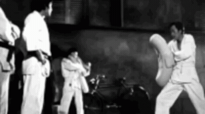 Men Practicing Martial Arts In Gym GIF