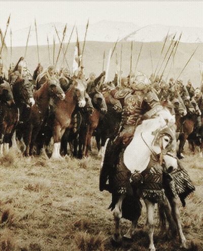 Men Riding Horses With Spears GIF