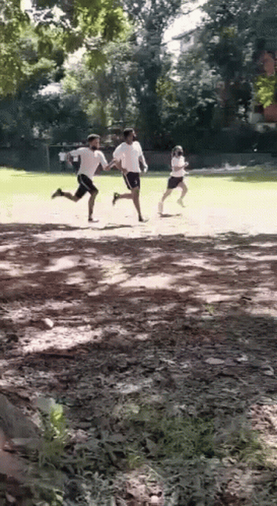 Men Running On Dirt Field GIF