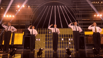 Men Saluting On Stage Saying Non GIF
