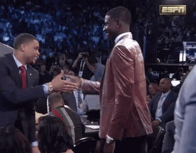 Men Shaking Hands In Front Of ESPN Sign GIF