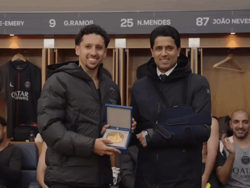 Men Shaking Hands: Qatar Airways And Black Jacket GIF