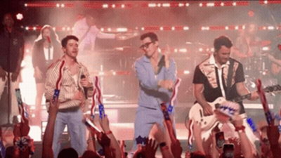 Men Singing And Playing Guitars For Crowd GIF