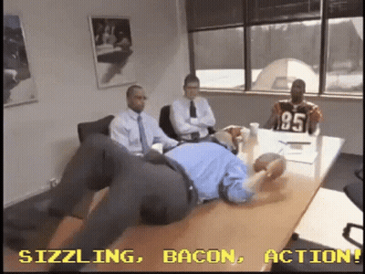 Men Sitting Around Table One Wearing Jersey 95 GIF