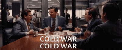Men Sitting Around Table Saying Cold War GIF