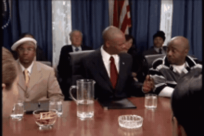 Men Sitting Around Table With Pitcher Of Water GIF