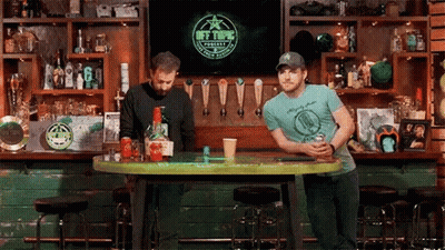 Men Sitting At Bar Watching TV GIF