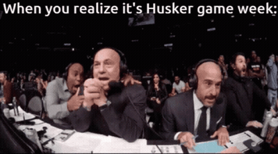Men Sitting at Table Husker Game Week Realization