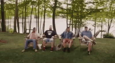 Men Sitting In Chairs By Lake GIF