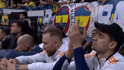 Men Sitting In Front Of Sa Kulu Banner GIF