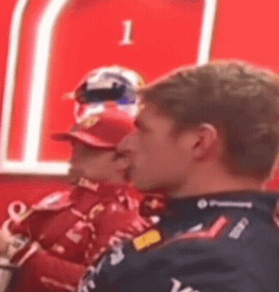 Men Sitting In Front Of Sign 1 GIF