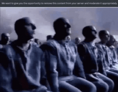 Men Sitting In Row Eyes Closed Dark Room GIF