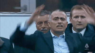 Men Sitting In Stadium One In Suit GIF