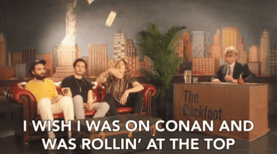 Men Sitting On Couch In Front Of Desk Saying The Backfoot GIF