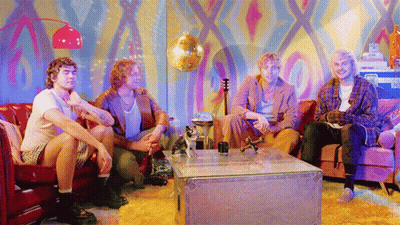 Men Sitting On Couch With Disco Ball GIF