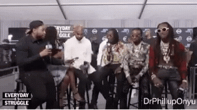 Men Sitting On Stools In Room GIF